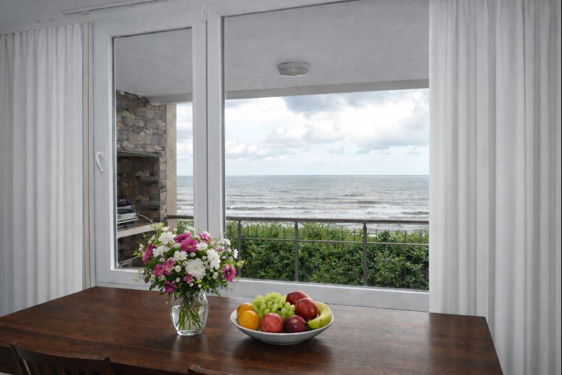 Fruit on a table with sea view